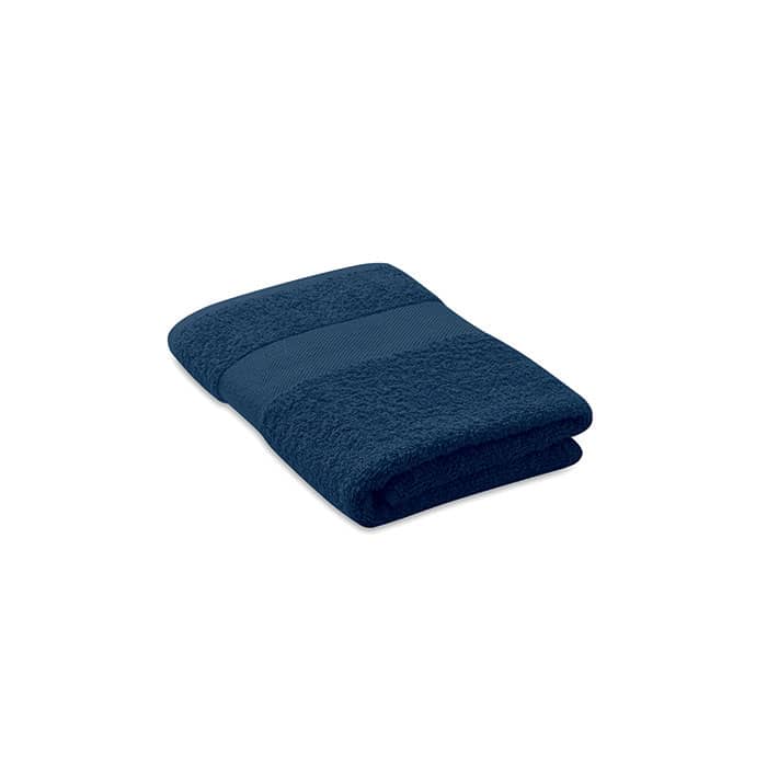 A navy blue towel folded neatly, featuring a textured stripe design. The towel appears soft and plush.