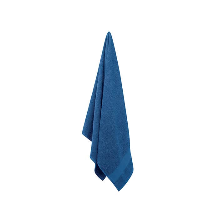 A blue towel hanging, featuring a soft texture and a neat fold at the bottom. It has a simple, clean design.