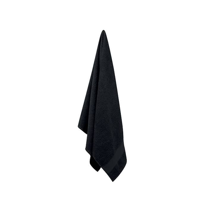 A black towel hanging, made of soft fabric with a textured finish and a neat edge. It has a branding logo.