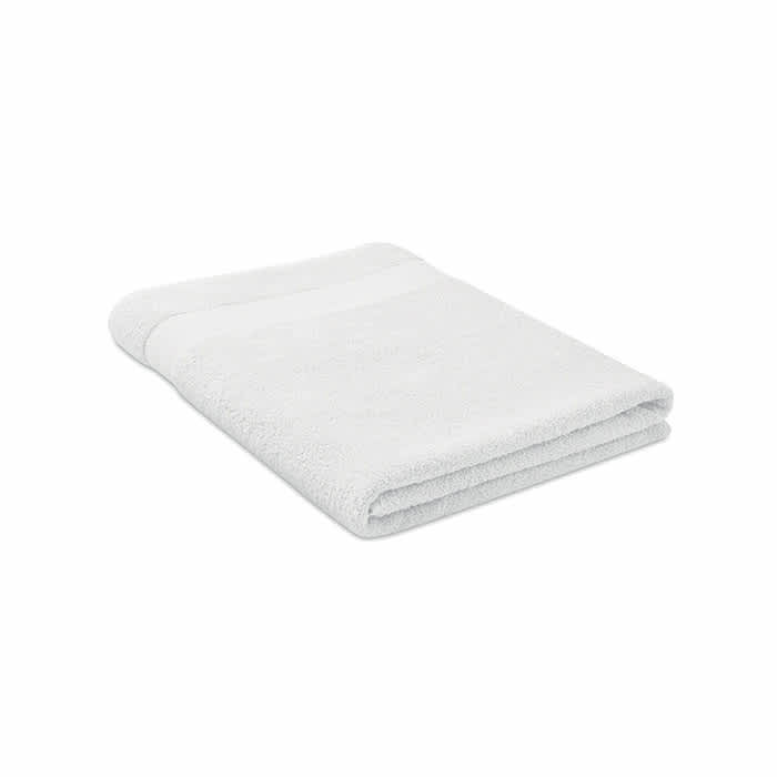 A fluffy white towel folded neatly, featuring a textured band along one edge.
