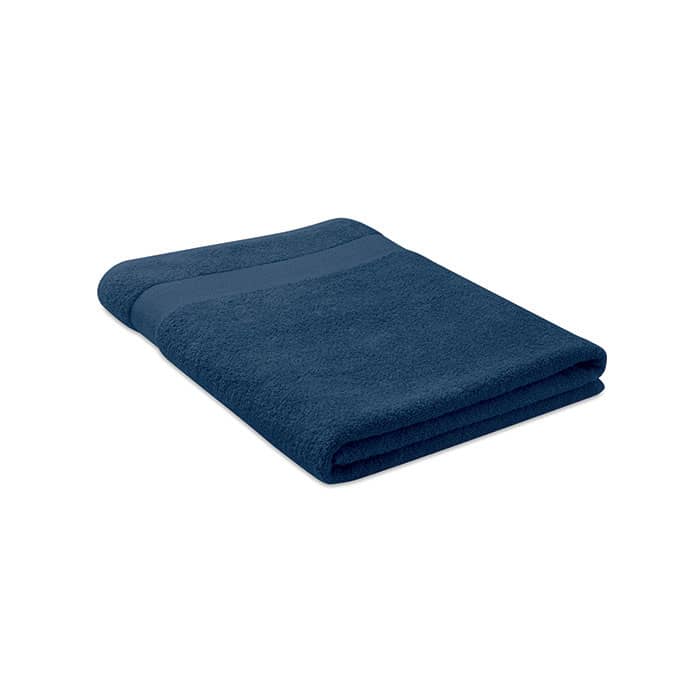 A folded navy blue towel with a textured stripe across the centre, featuring a simple design.