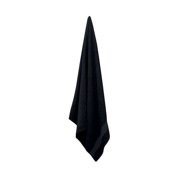 A black towel hangs in a triangular shape, featuring a simple design and a subtle texture.