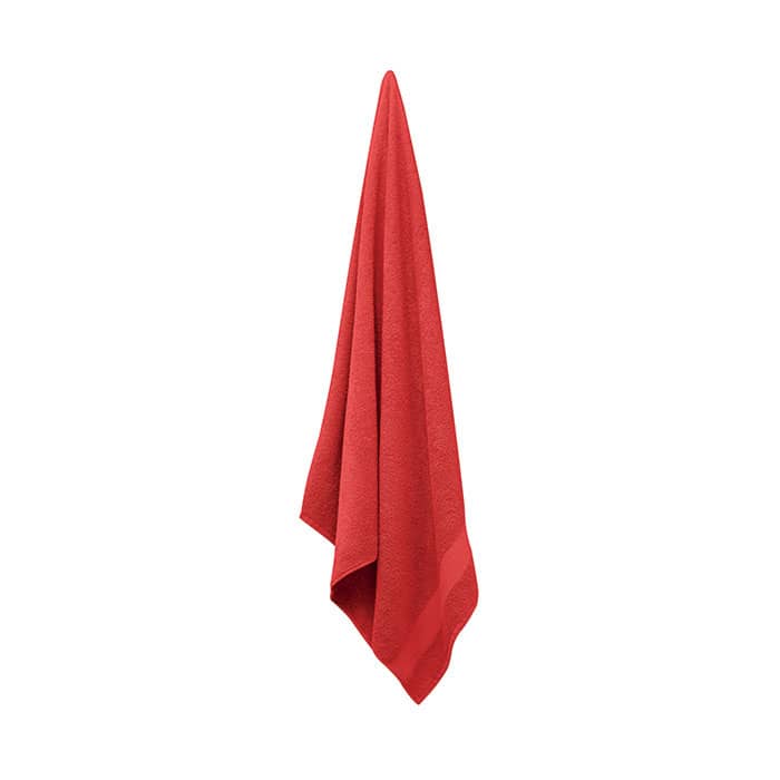 A red towel hangs elegantly, displaying its soft texture and vibrant colour. The towel has no visible branding.