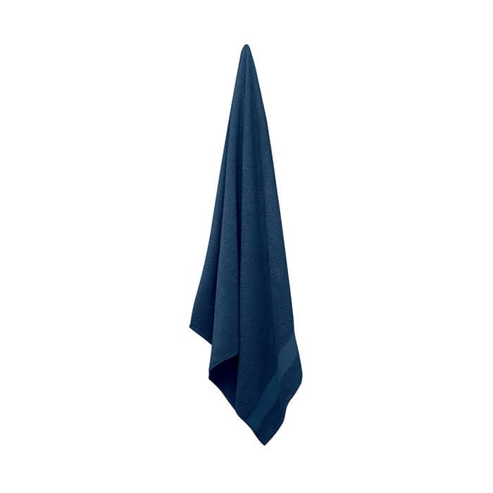 A navy blue towel is hanging, showcasing its soft fabric and folded edges. It has a simple design without any branding.