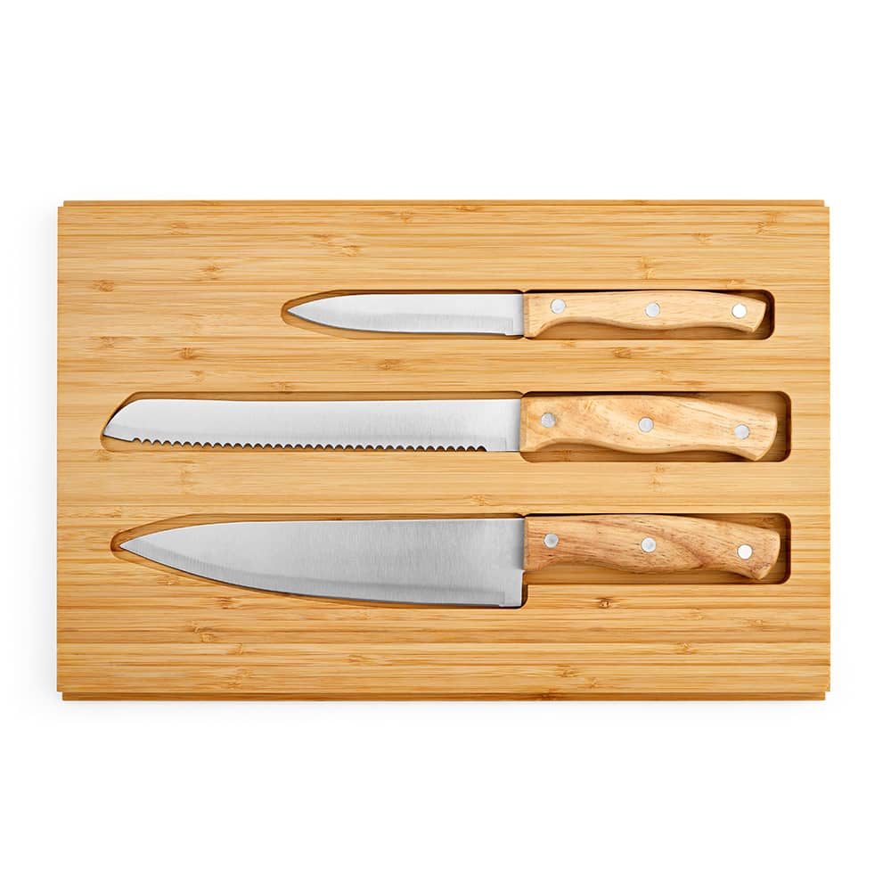A bamboo cutting board with three kitchen knives featuring wooden handles. The knives include a chef's knife, serrated knife, and paring knife.