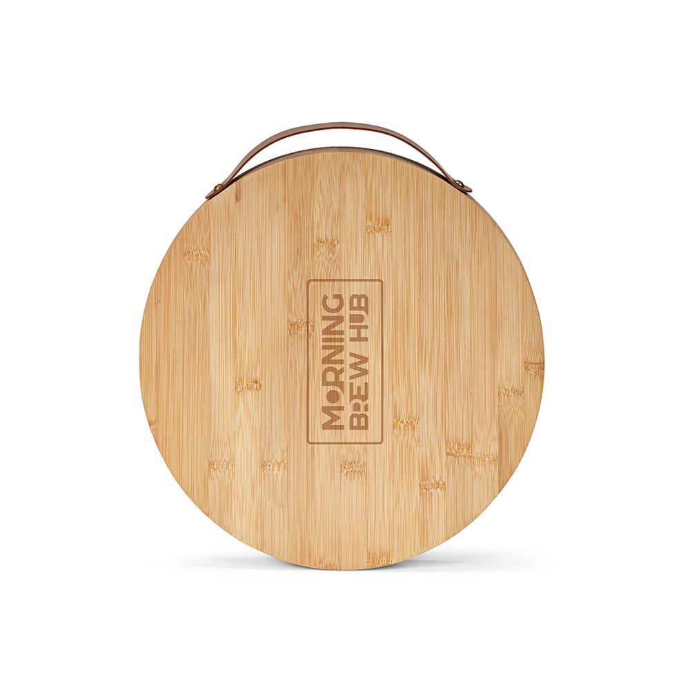 A round bamboo board with a handle, featuring a natural finish and an engraved logo.