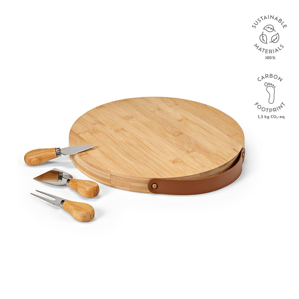 A bamboo cheese board with a leather handle, accompanied by wooden-handled utensils.