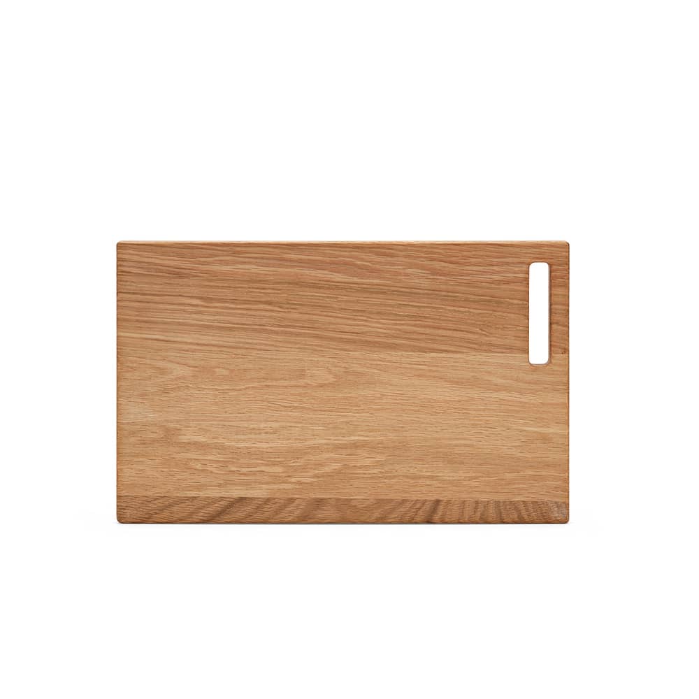 A wooden chopping board in a light oak finish featuring a built-in handle. It has a smooth, natural texture.
