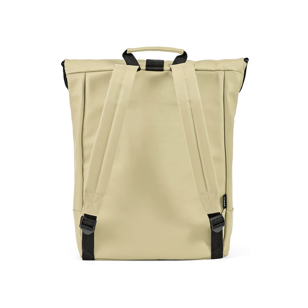 A beige backpack with black straps, featuring a logo, designed to fit a 17" laptop.