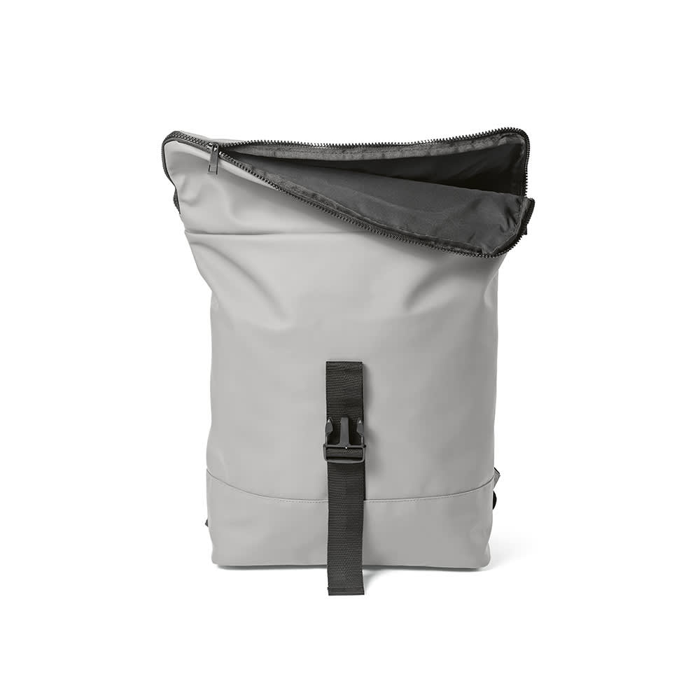 A grey backpack with a roll-top closure, adjustable strap, and a black interior. It features a logo.