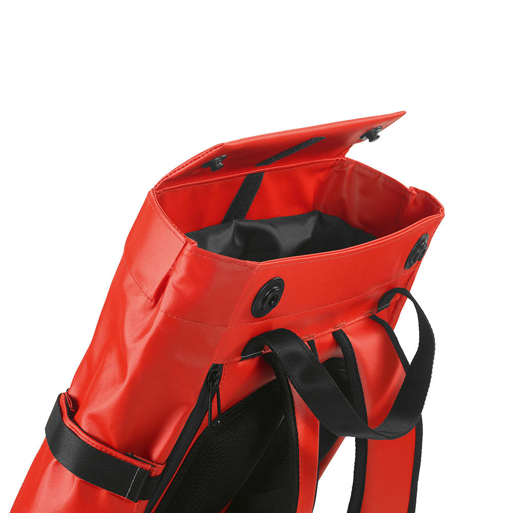 A red Wellington Backpack with a black interior, featuring a magnetic closing and adjustable straps.