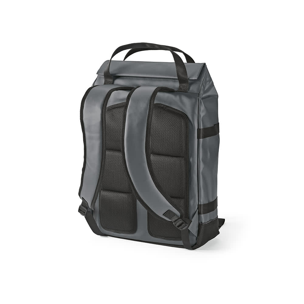 A grey Wellington Backpack with padded straps, featuring a magnetic closing and a logo. Suitable for a 17" laptop.