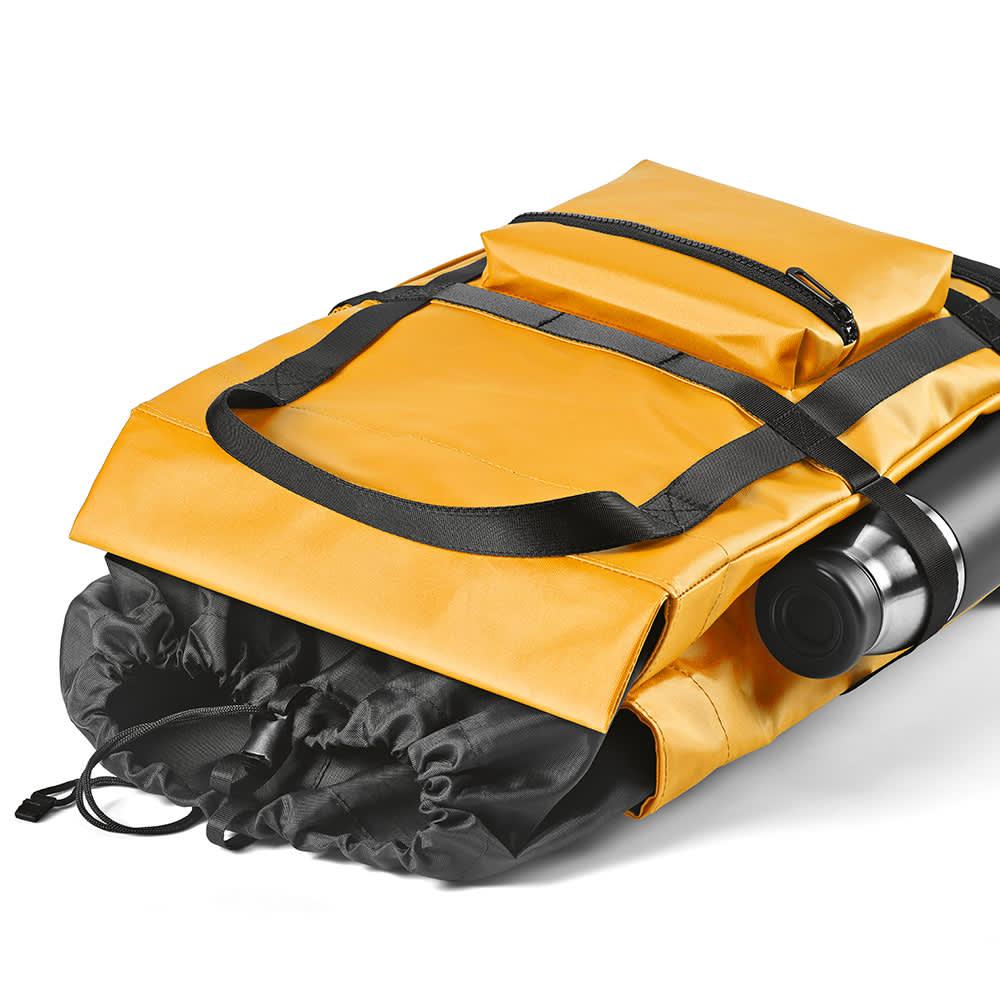A yellow Wellington Backpack with black accents, featuring a magnetic closing and a zippered pocket on top.