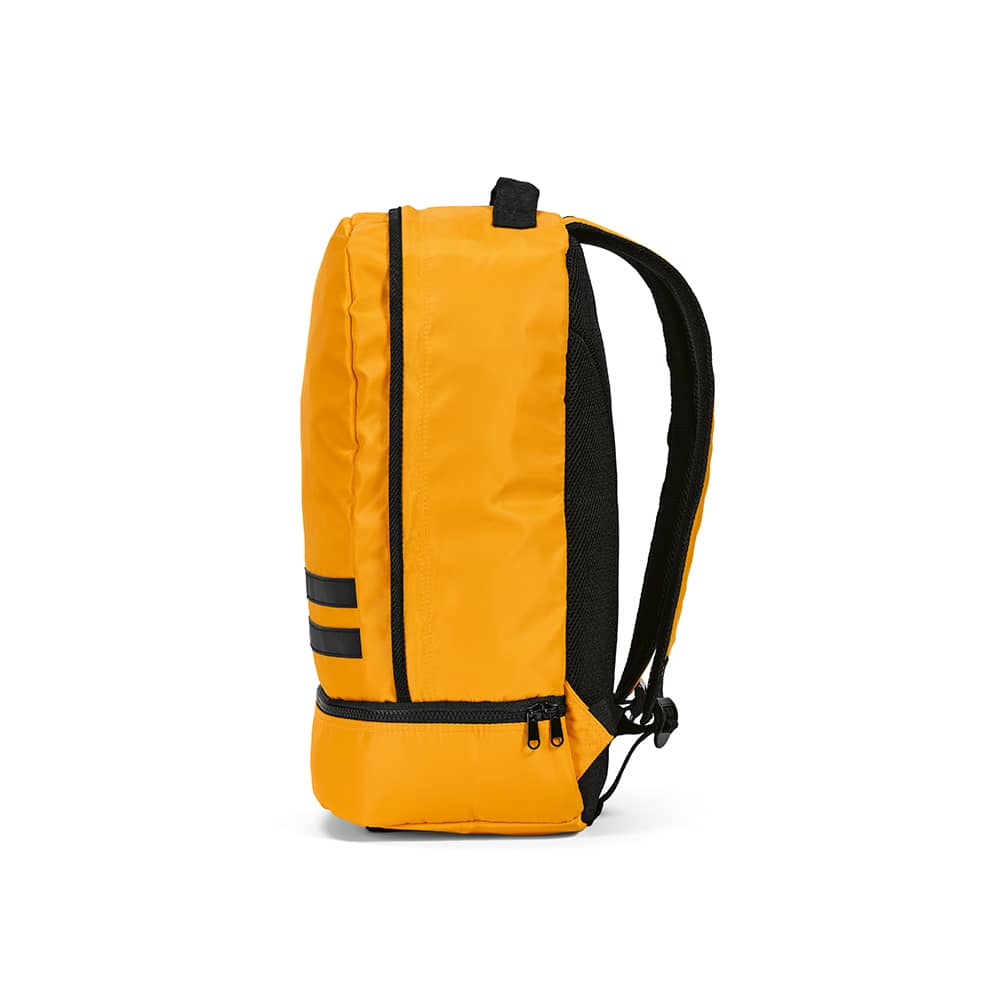 A yellow backpack with reflective front strips and black accents, featuring padded shoulder straps and a zippered compartment.