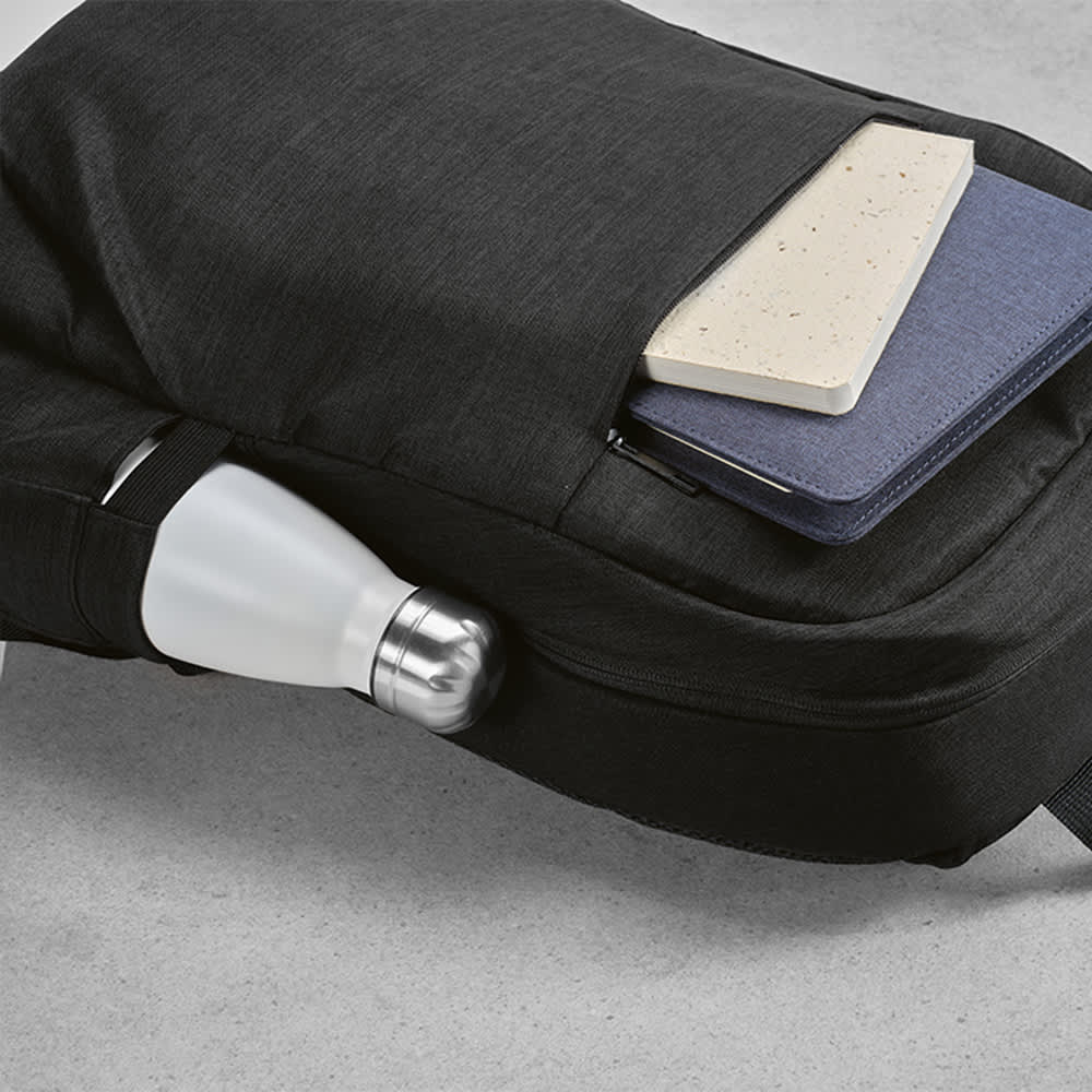 A black backpack featuring a front pocket, a drink bottle, and two notebooks visible. It has a logo.