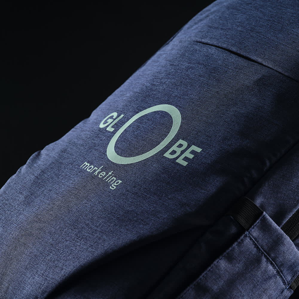 A navy blue backpack with a front pocket, designed to fit a 17" laptop, featuring a logo.