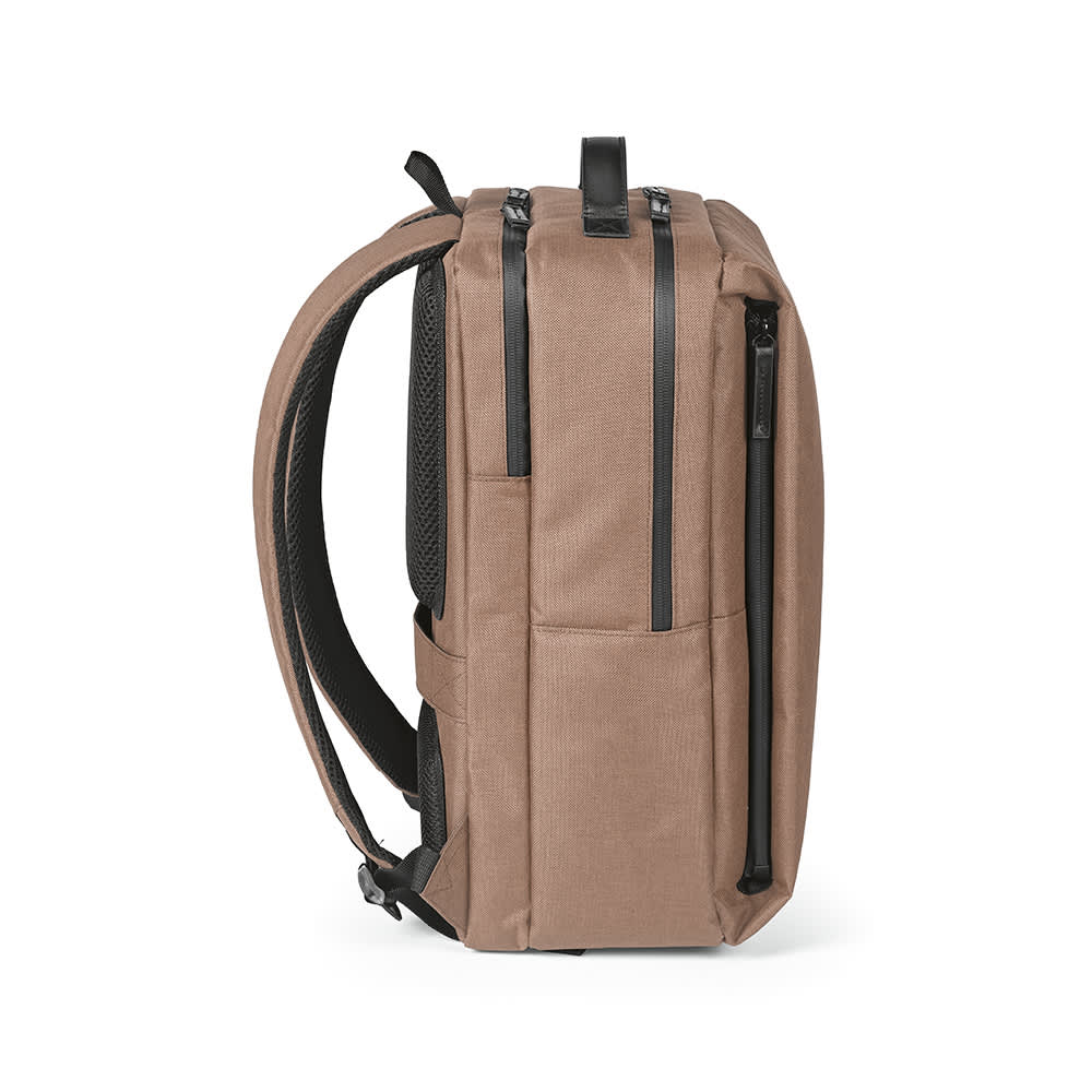 A brown Oslo Backpack with waterproof zippers, designed to fit a 17" laptop, featuring a sleek profile and one logo.