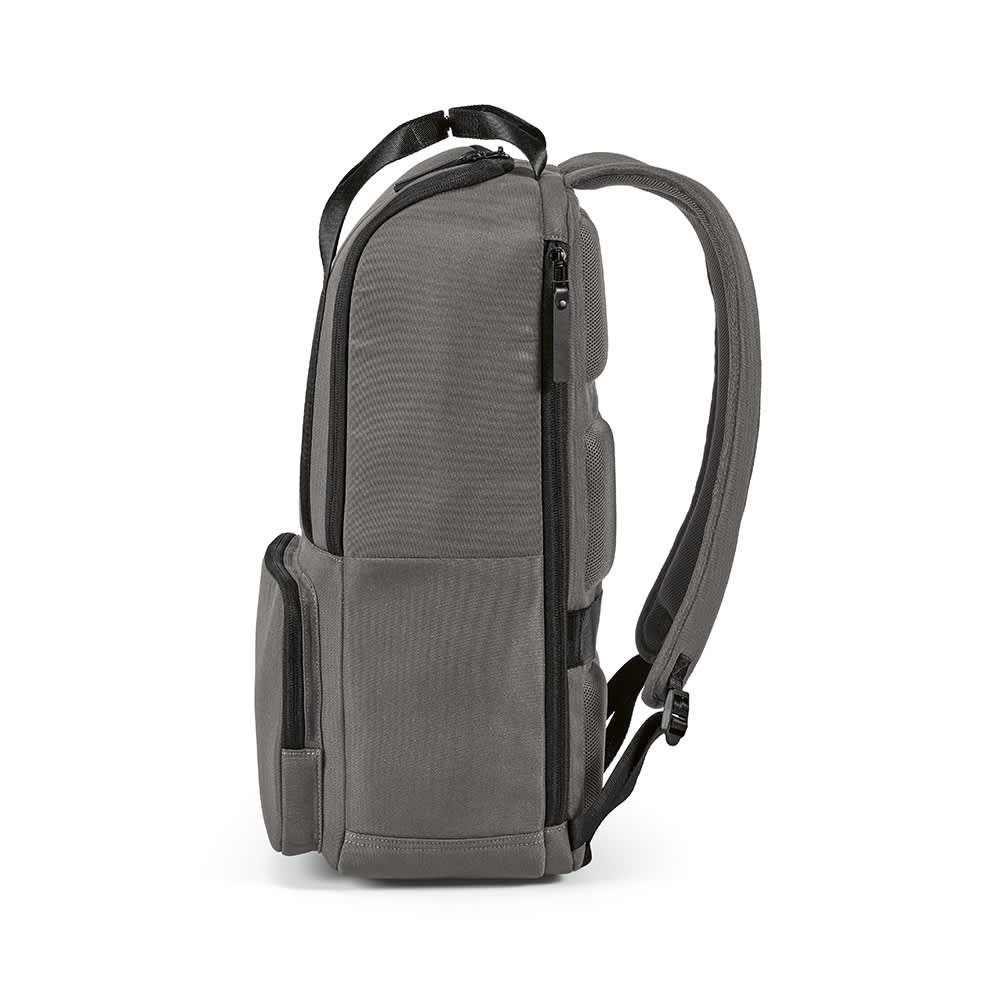 A grey backpack with a front pocket, designed to fit a 15.6" laptop, featuring shoulder straps and a logo.