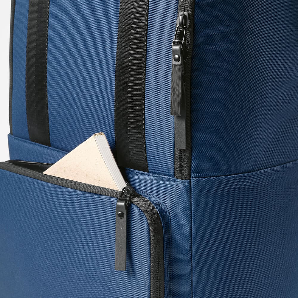 A blue backpack featuring a front pocket and zippers, designed to fit a 15.6" laptop. It has a logo.