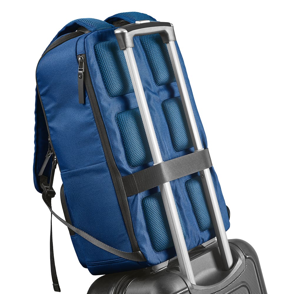 A blue backpack with a front pocket and adjustable straps, fitted onto a rolling suitcase. It features a logo.