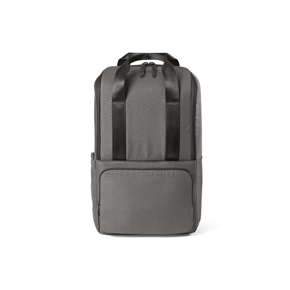 A grey backpack with a front pocket, designed to fit a 15.6" laptop. It features two black straps and has a logo.