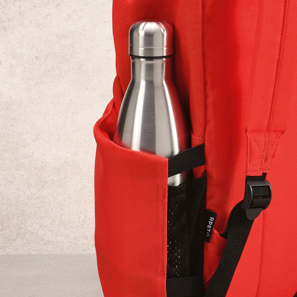 A red backpack featuring a metal drink bottle in a side pocket, designed for carrying a 17" laptop.