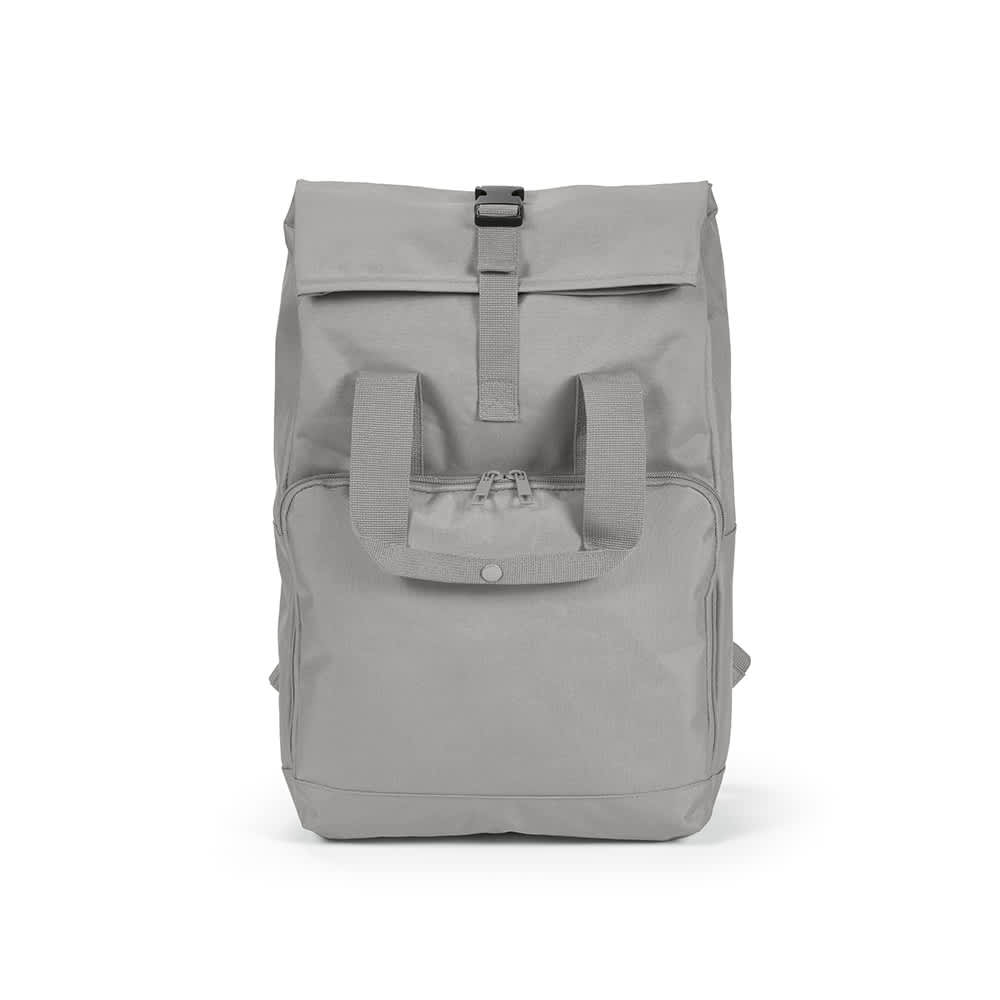 A grey backpack with a roll top and buckle closure, featuring front zip pocket and carry handles. It has a logo.