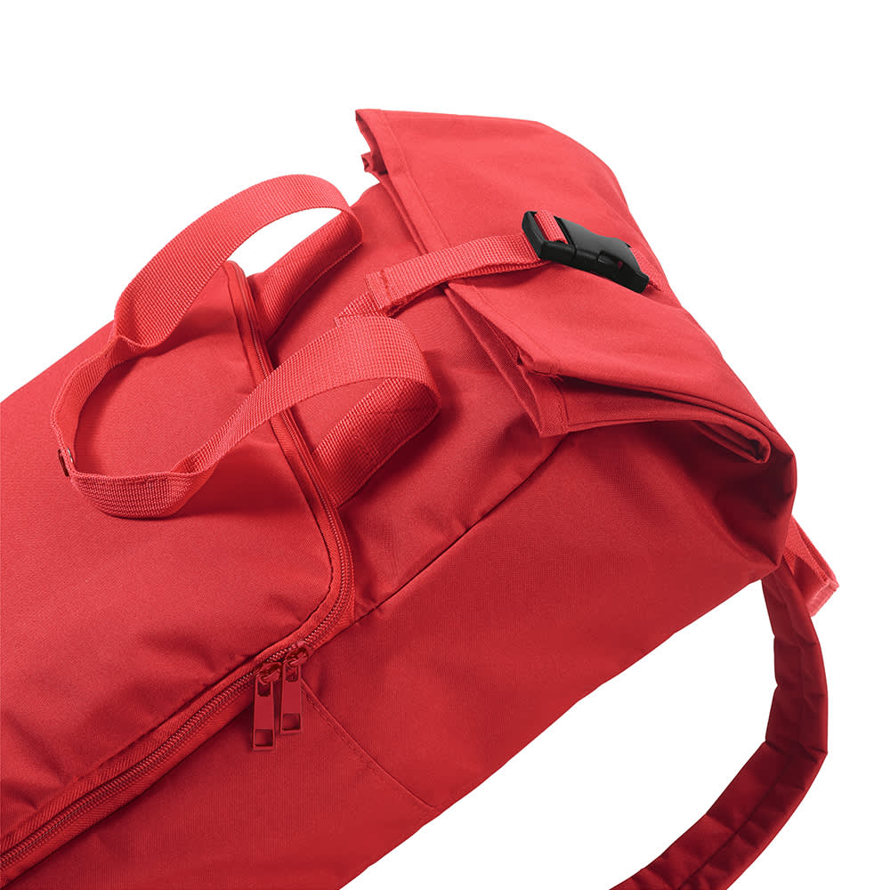 A red backpack featuring a roll top and buckle closure, with two carry handles and a strap. It has a logo.