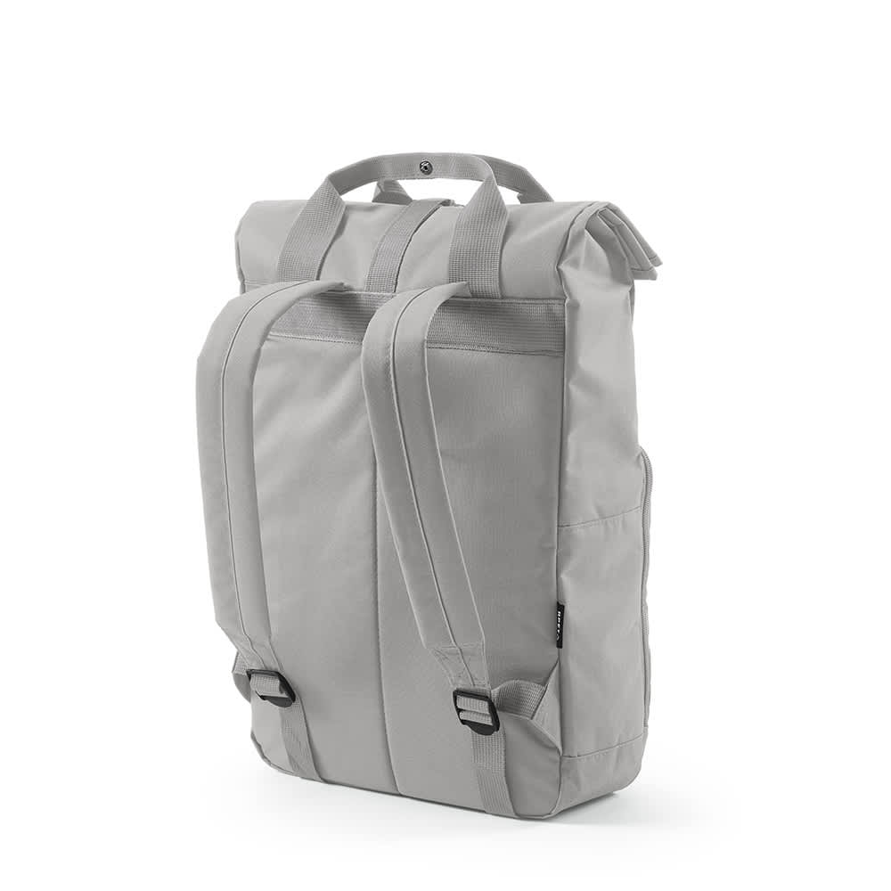 A grey backpack with a roll-top and buckle closure, featuring two adjustable shoulder straps and a branding logo.