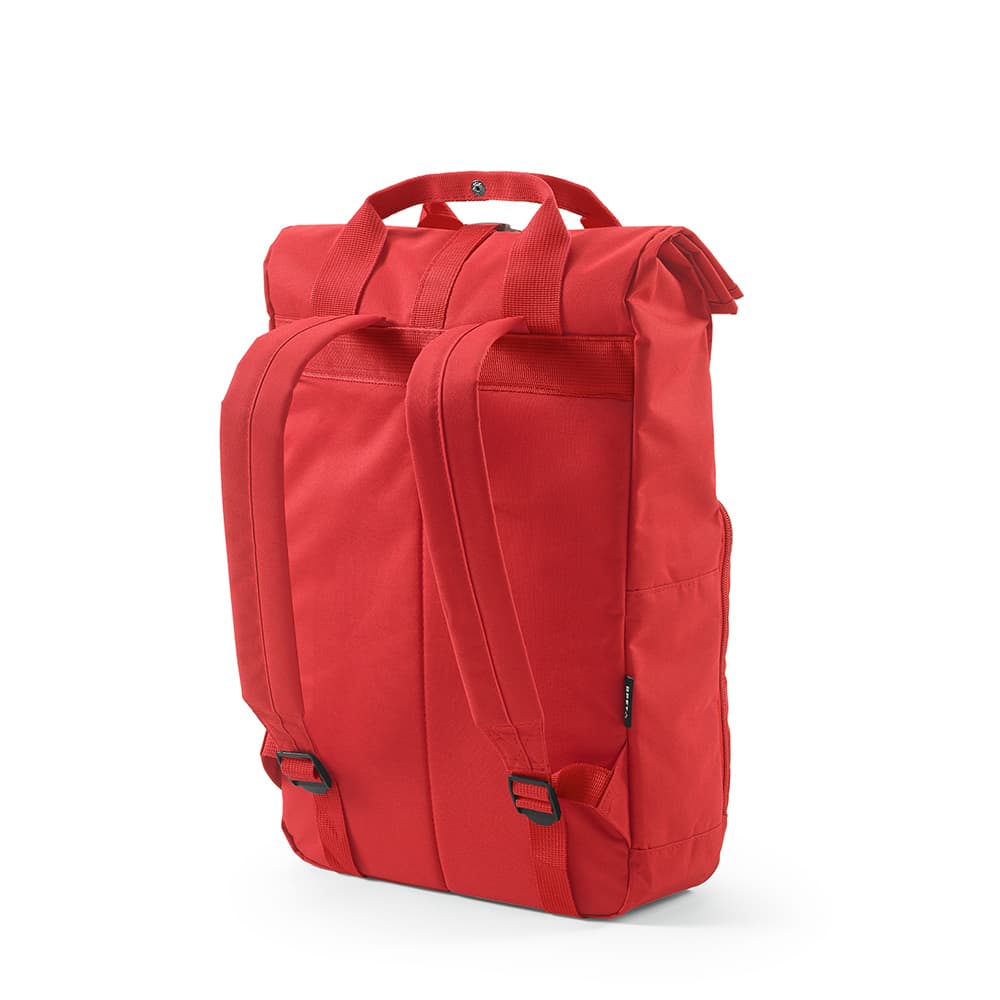 A red Warsaw Backpack with a roll top, buckle closure, and adjustable shoulder straps. It features a logo.