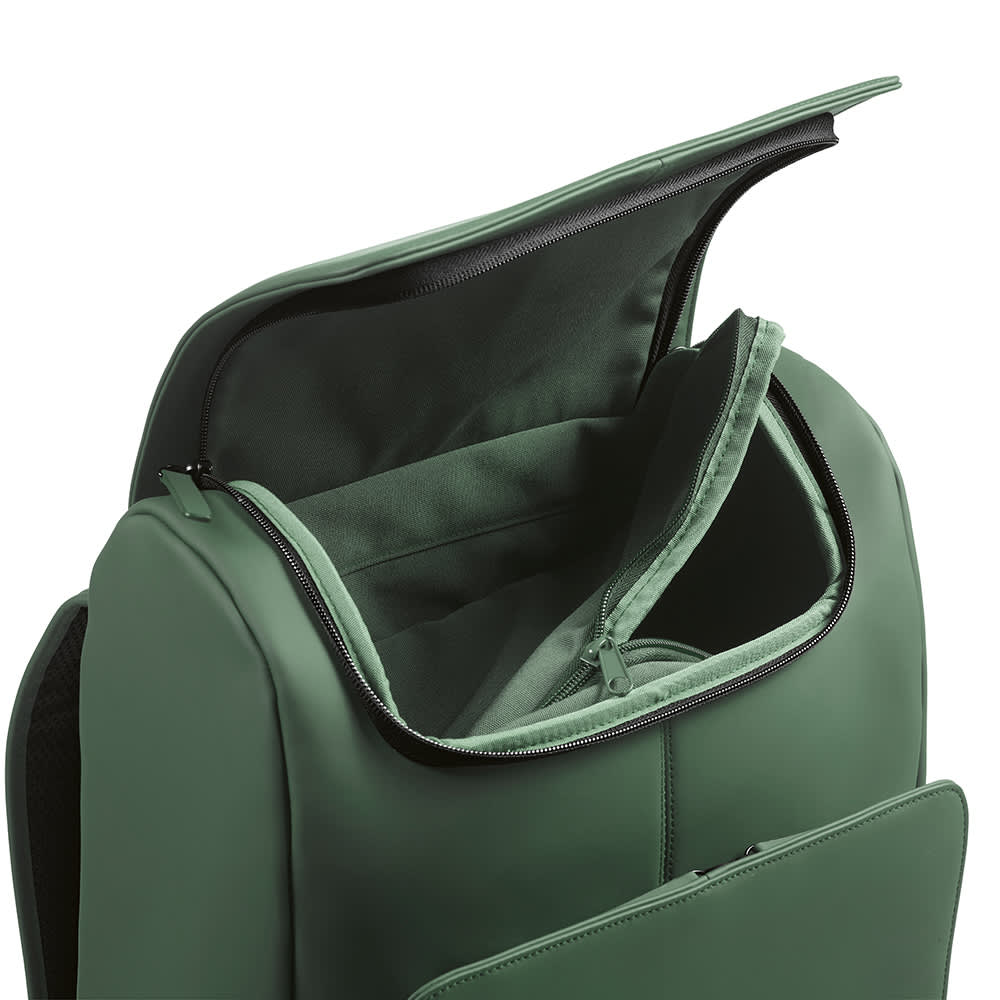 A green backpack with a zippered opening, featuring a padded compartment suitable for a 15.6" laptop. 