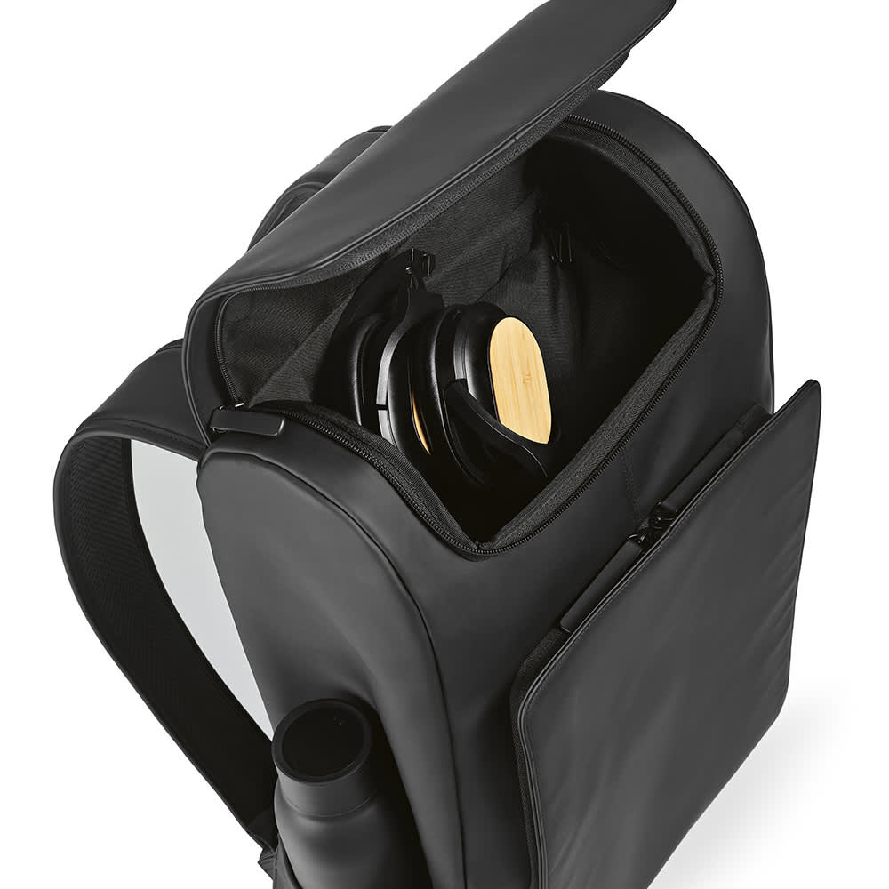A black backpack opened to reveal a compartment with headphones and a drink bottle holder. It has a logo.