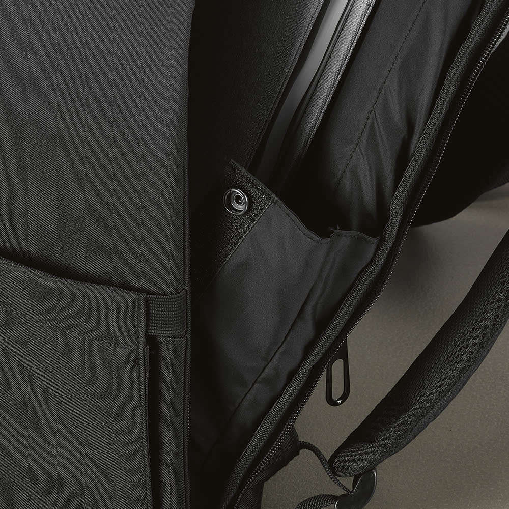 A black backpack featuring a front pocket and an internal compartment designed to fit a 17" laptop. It has a logo.