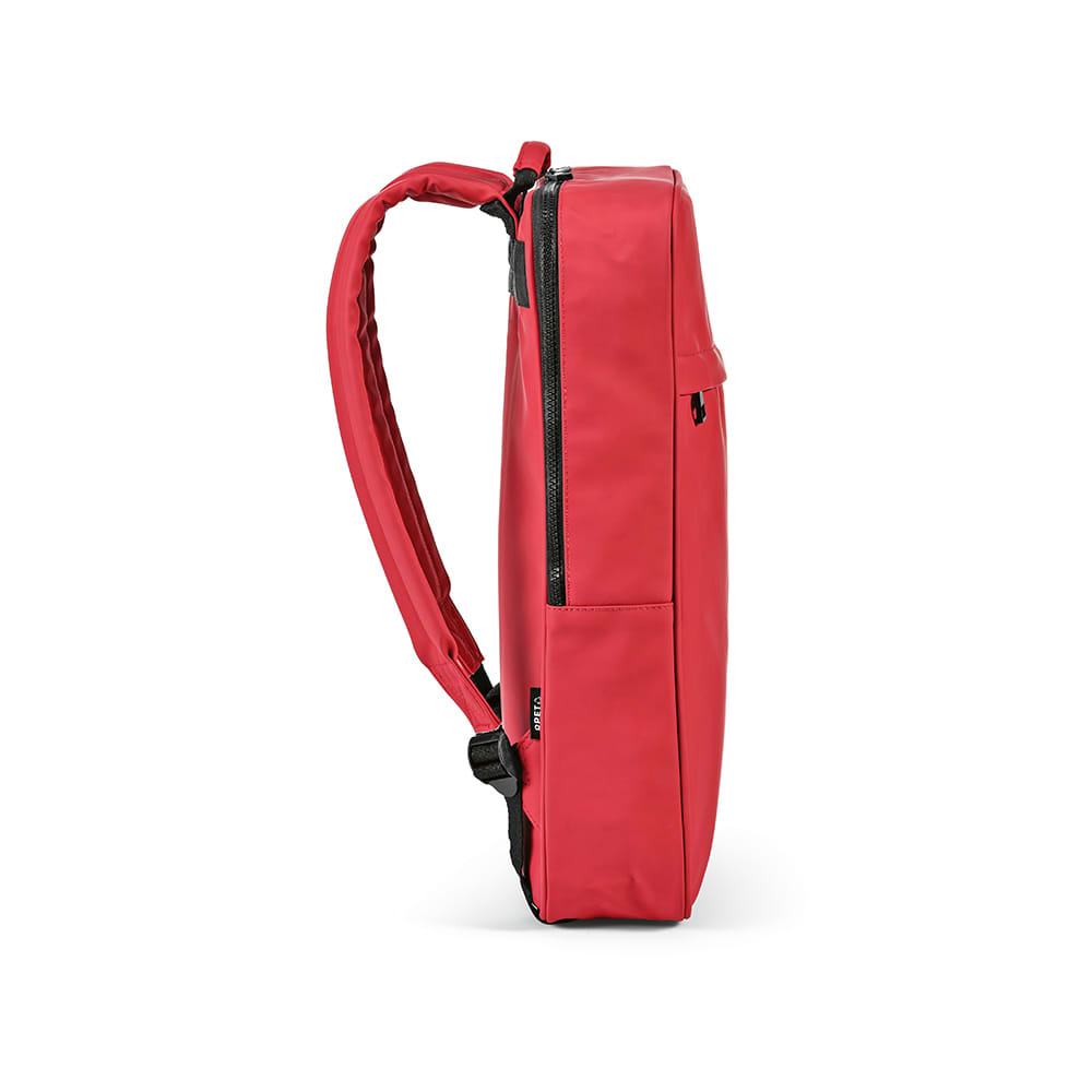 A red backpack with a sleek design and adjustable straps, featuring a side zip pocket and a logo.