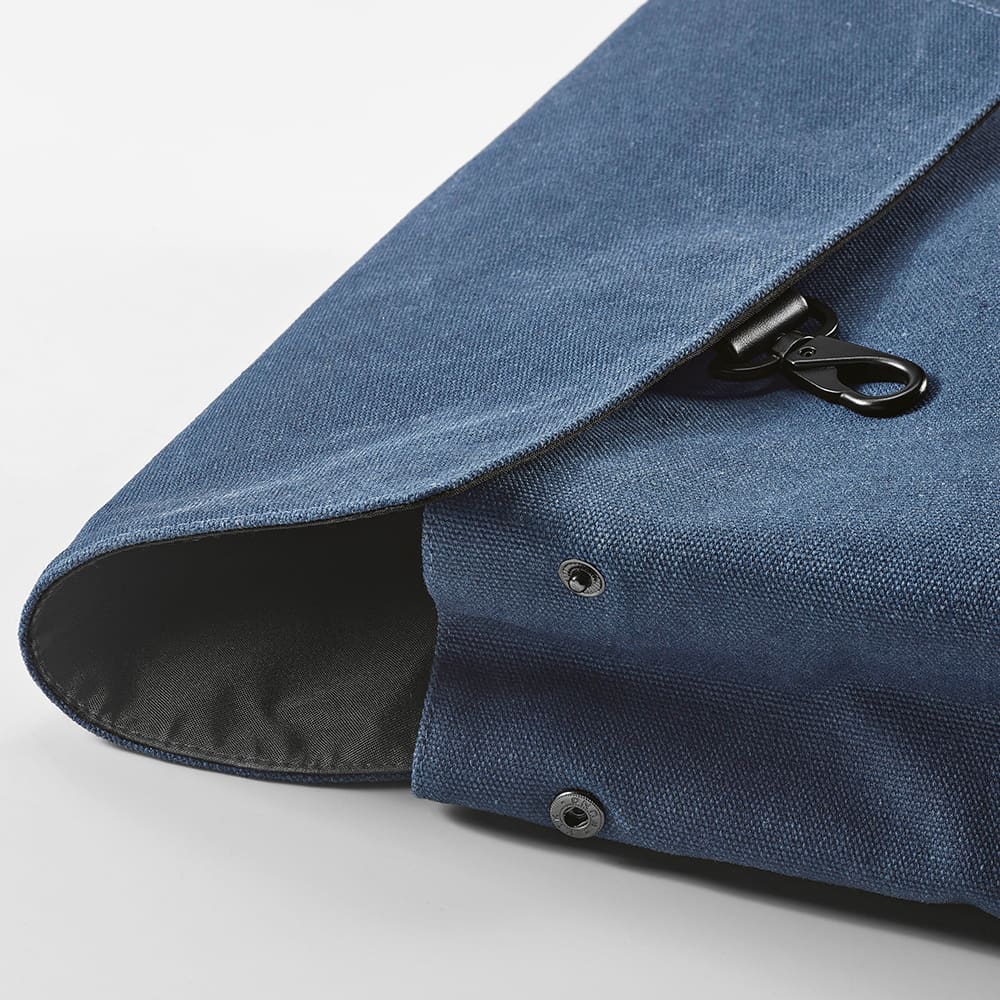 A navy blue backpack with a hook closure, featuring a flap and fasteners. Suitable for a 17" laptop.