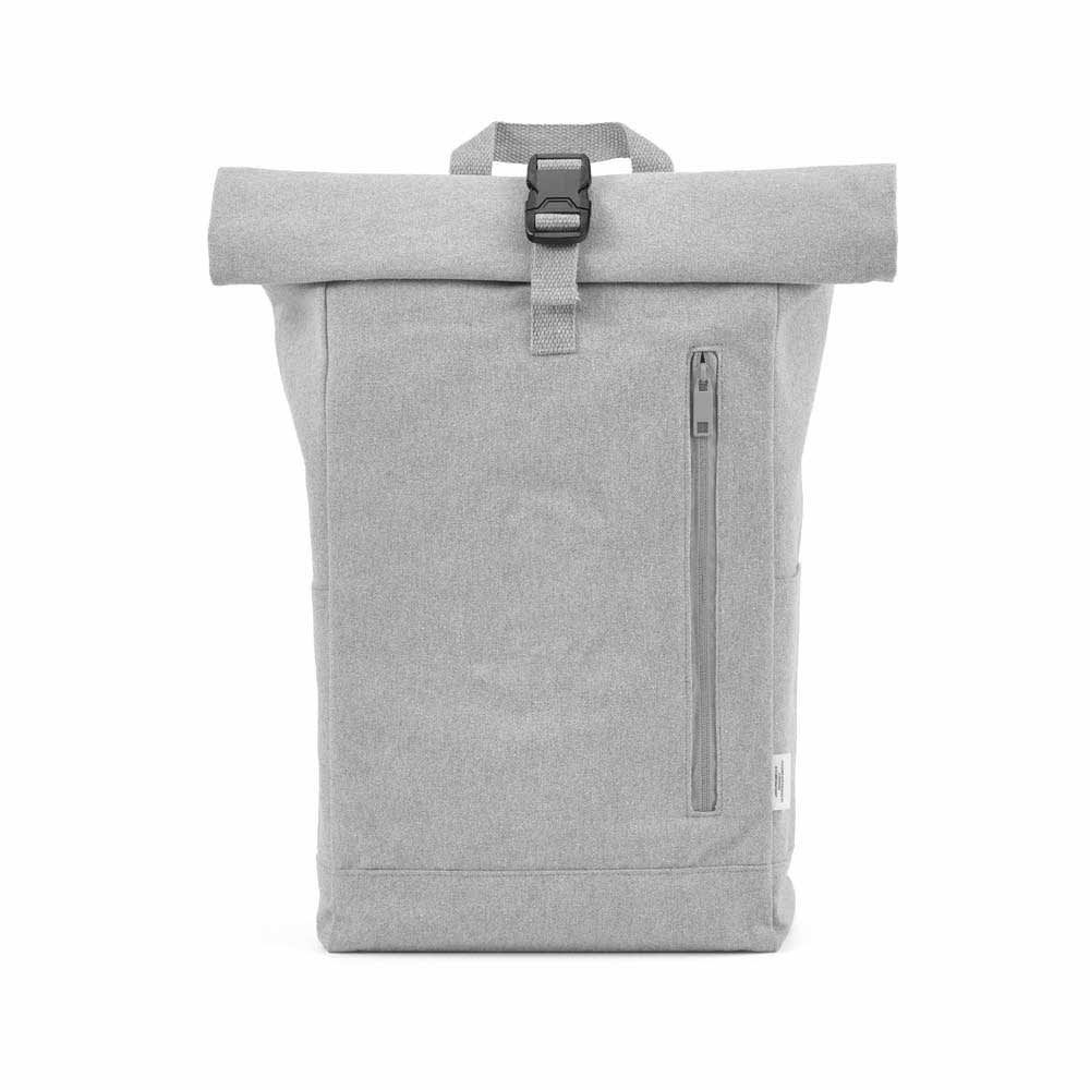 A grey roll-top backpack with a buckle closure and a front zip pocket, featuring a logo on the side.