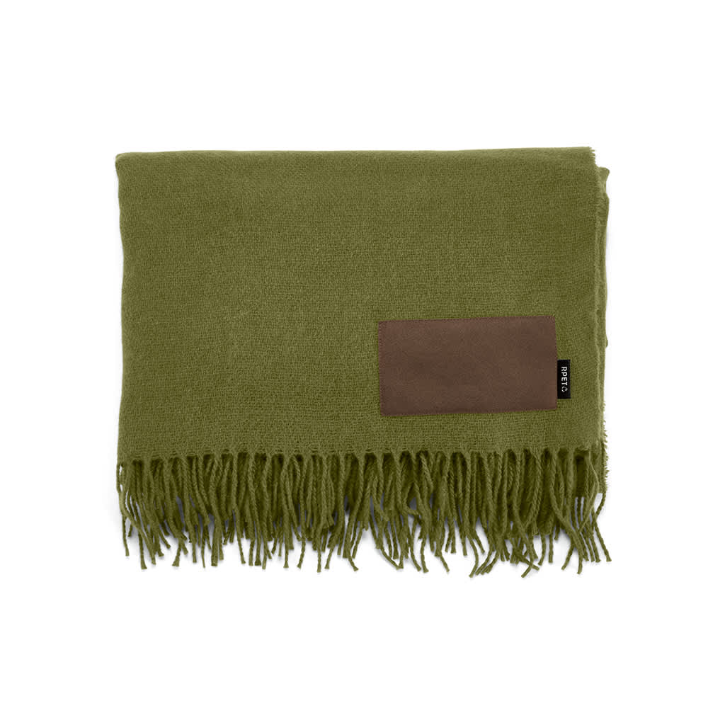 A green blanket with fringed edges and a brown customisable patch. It features a logo on one side.