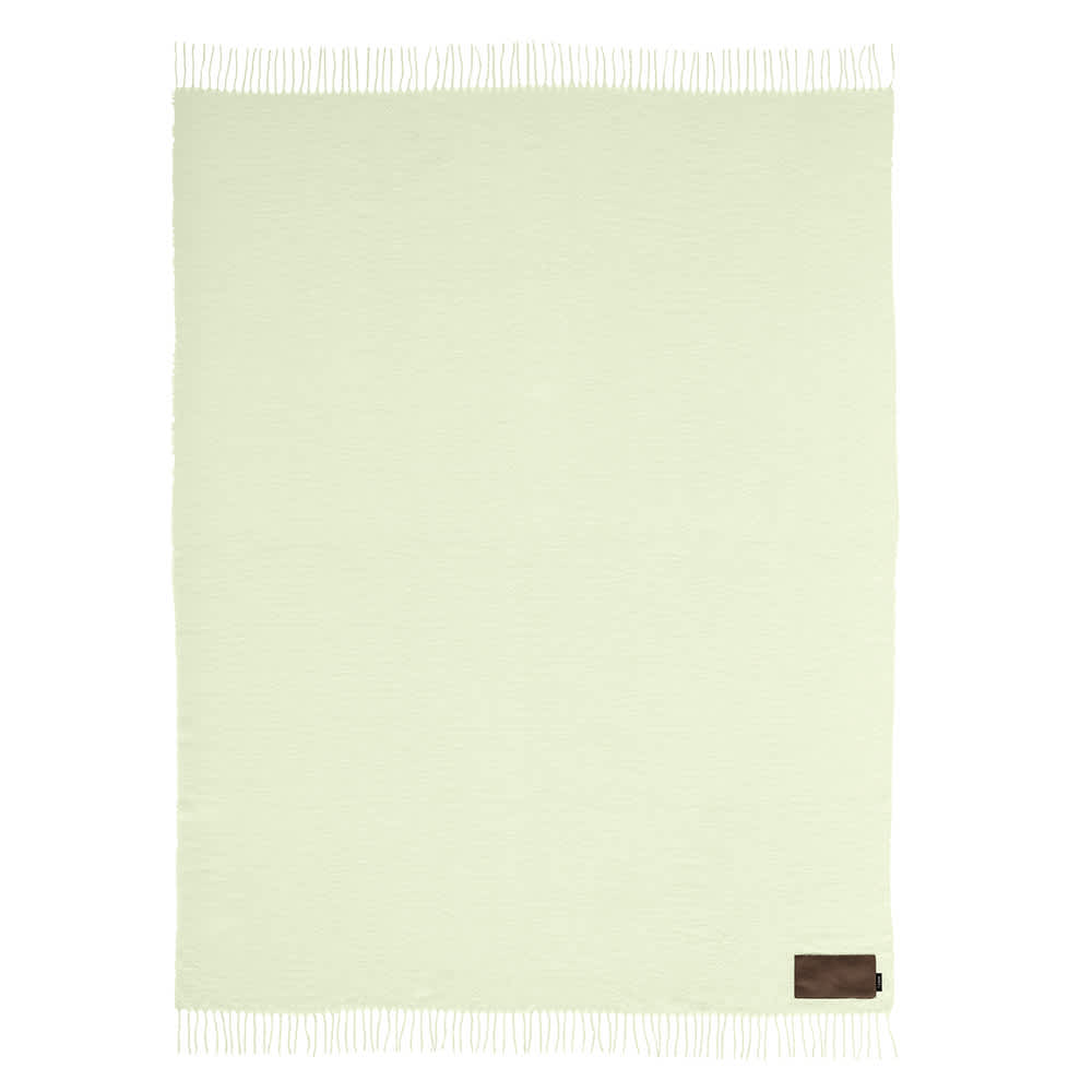 A light green blanket with fringed edges and a small logo patch. Customisable design available.