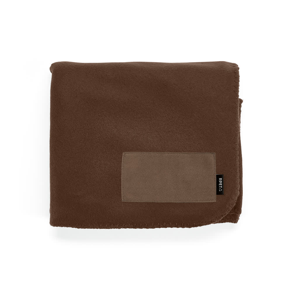 A brown fleece blanket made from rPET, featuring a customizable patch and a small black label.