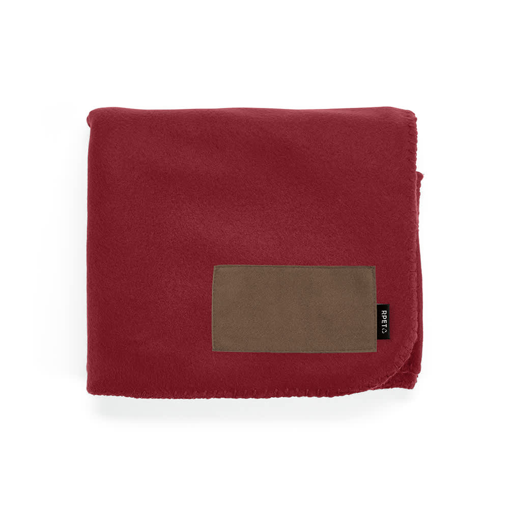 A burgundy fleece blanket with a brown customisable patch and a logo.