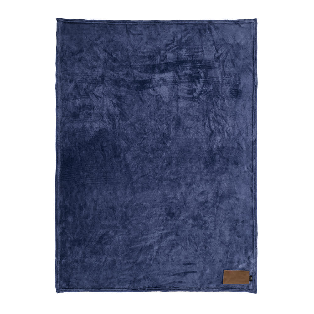 A navy blue fleece blanket with a customisable patch and a small branding label in the corner.