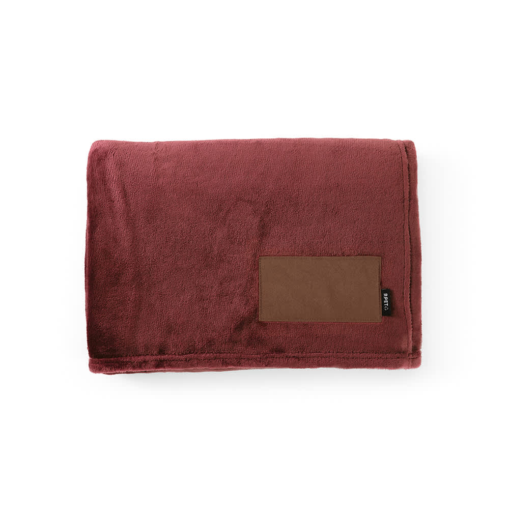 A burgundy blanket made from rPET fabric with a brown customisable patch. It features a logo.