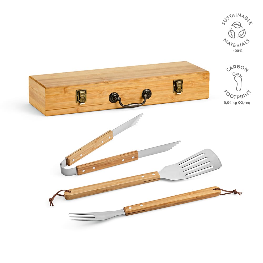 A bamboo case containing a tong, fork, and spatula with bamboo handles and stainless steel accents.
