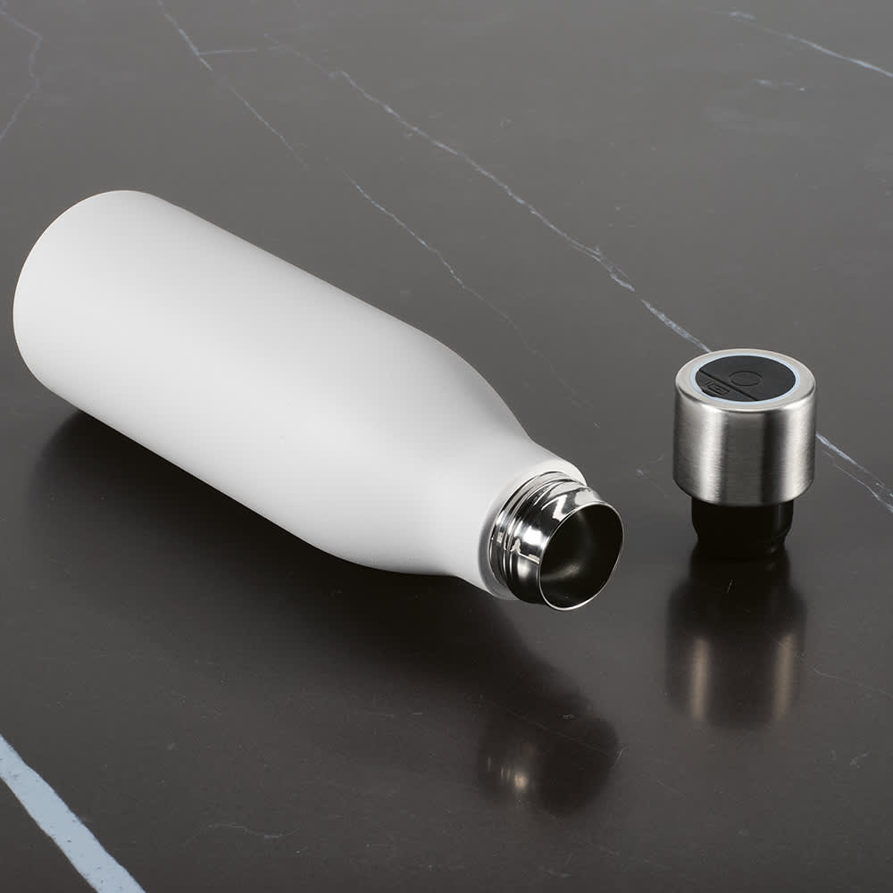 A drink bottle in matte white with a stainless steel cap. It features a sleek, double-wall design and has a logo.