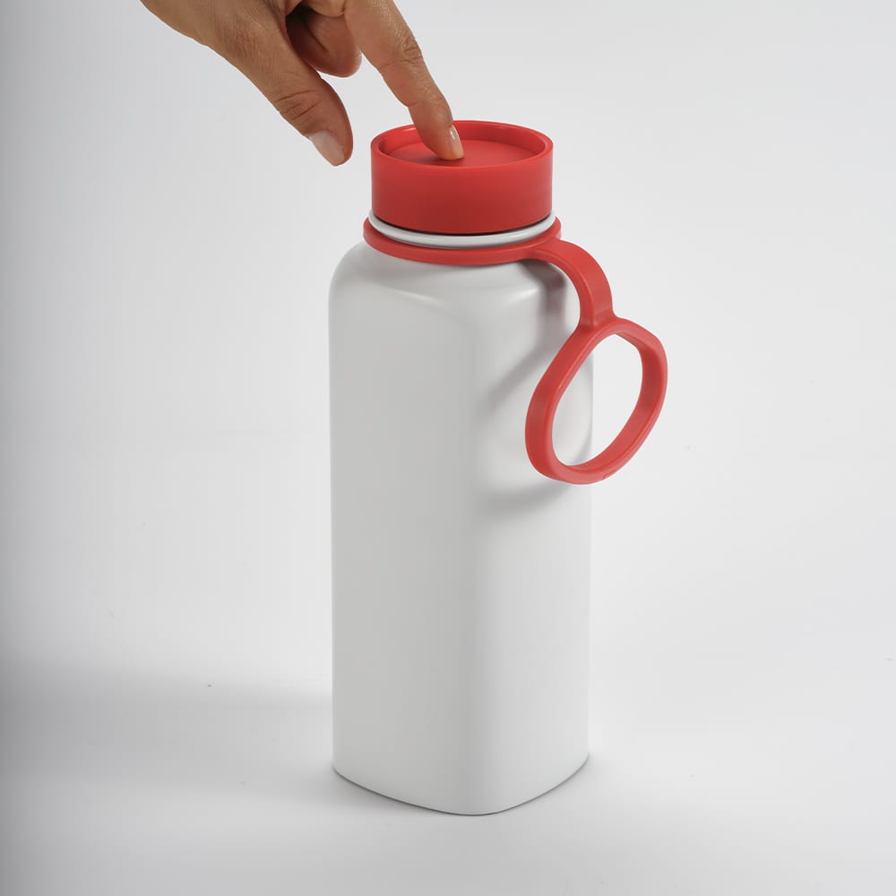A drink bottle with a white body, red lid, and a red handle, featuring a push lid design and a branding logo.