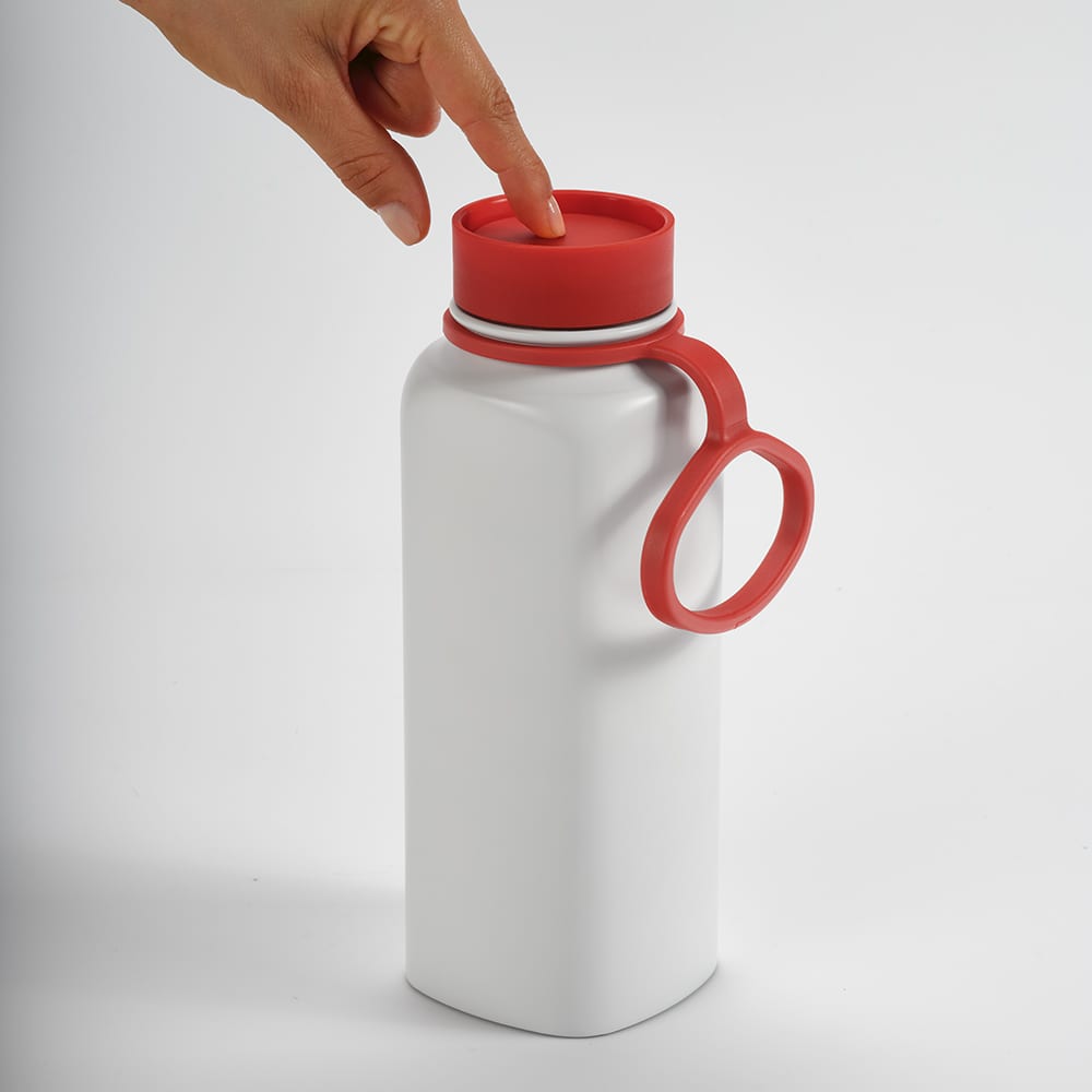 A drink bottle with a white body and red lid, featuring a leakproof design and a handle. It has a logo.