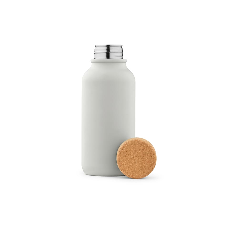 A drink bottle in matte grey with a silver lid and a cork stopper beside it. Features a single wall and is leakproof.