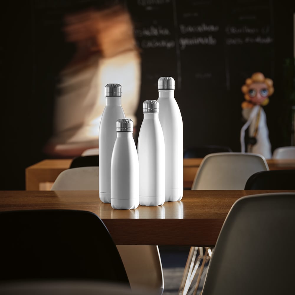A drink bottle collection featuring four white, double-walled bottles, set on a wooden table in a café environment.
