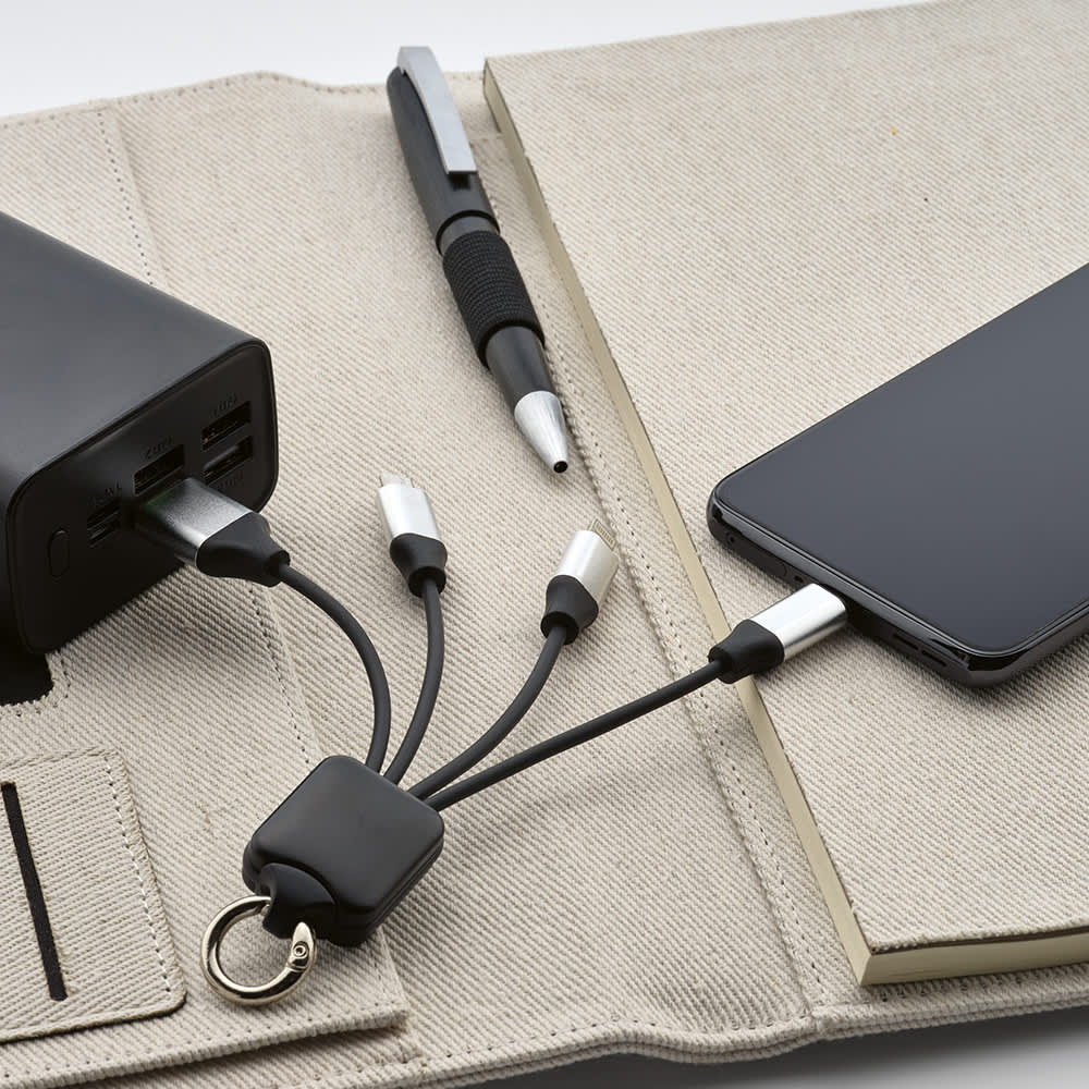 A 4-in-1 charging cable with a backlit logo, in black, connected to a power bank and a smartphone.