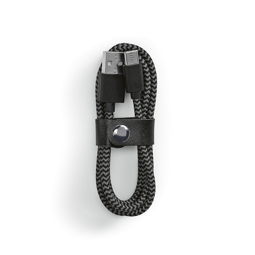 A black and grey braided USB-A to USB-C cable, neatly coiled and secured with a leather strap.